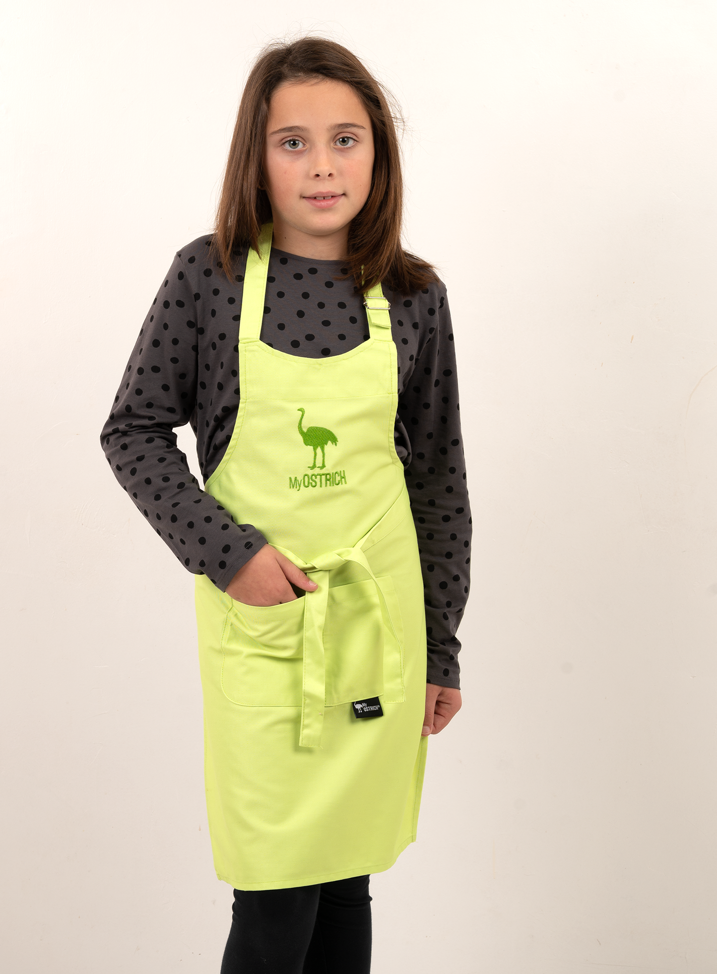 Delantal infantil verde con bolsillos